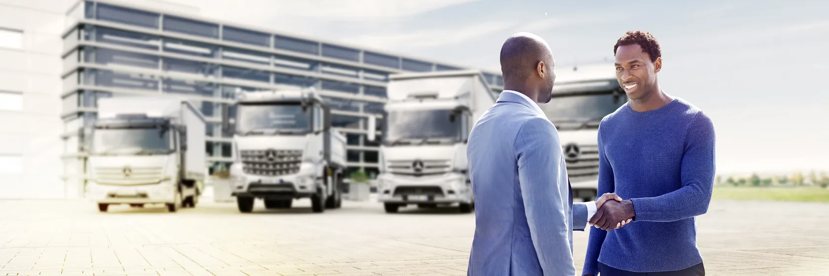 Business partners reviewing a contract, Truck Finance